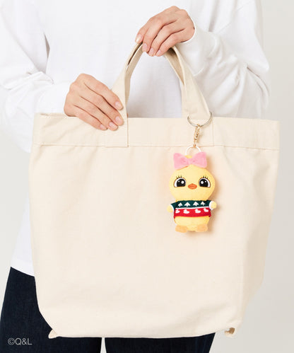 Ugly Sweater Mascot Lola on a tote bag, held