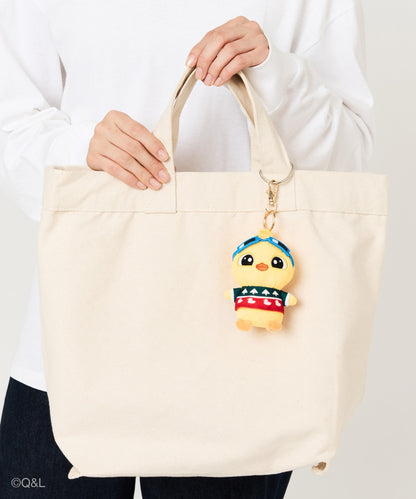 Ugly Sweater Mascot Quack on a tote bag, held