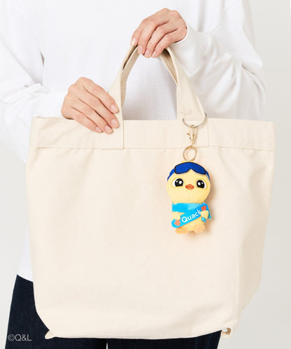 Snowboarding Mascot Quack on a tote bag, held